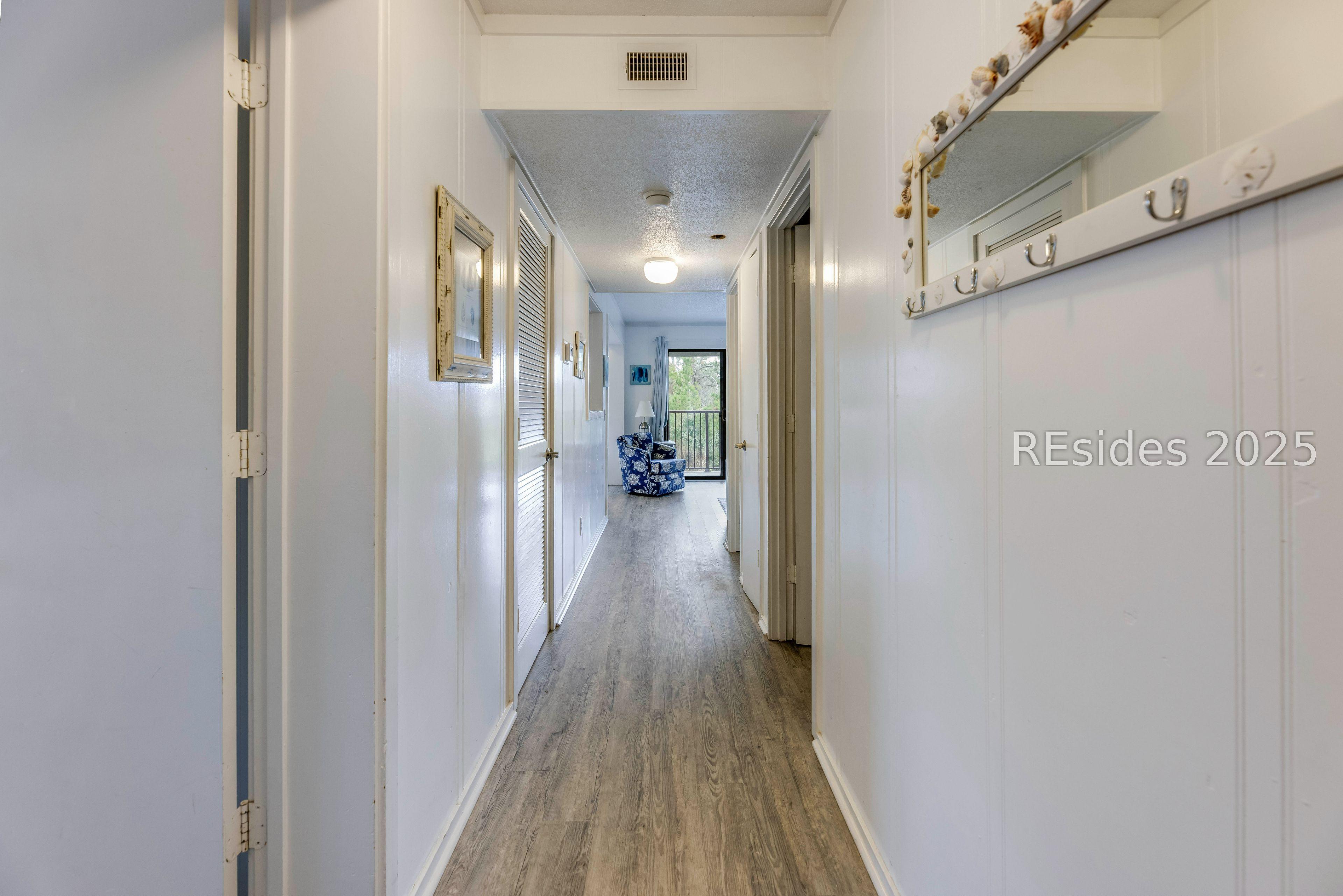 Image 3: New flooring throughout enhances entry hall.