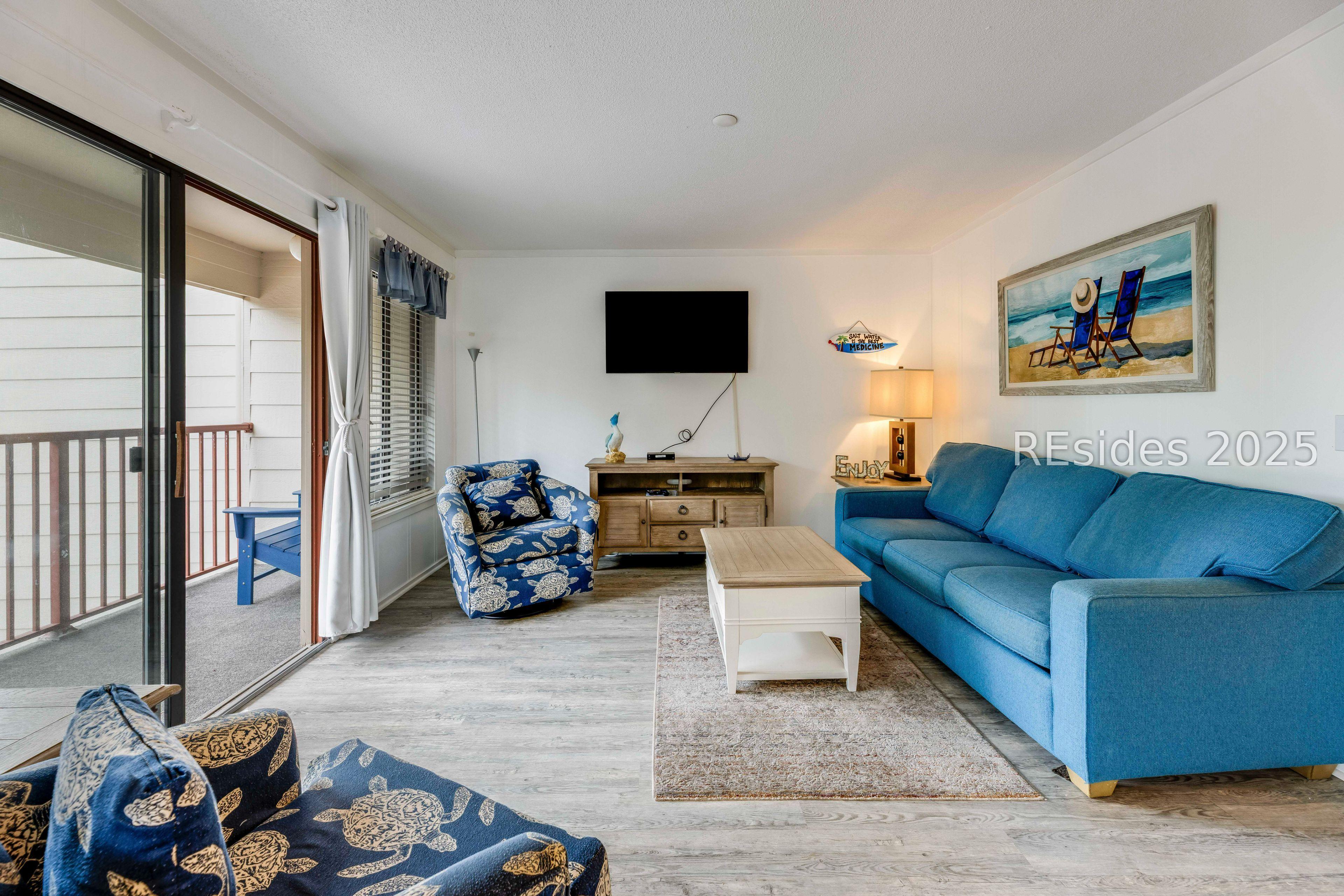 Image 4: Comfortable living room flows easily to deck.