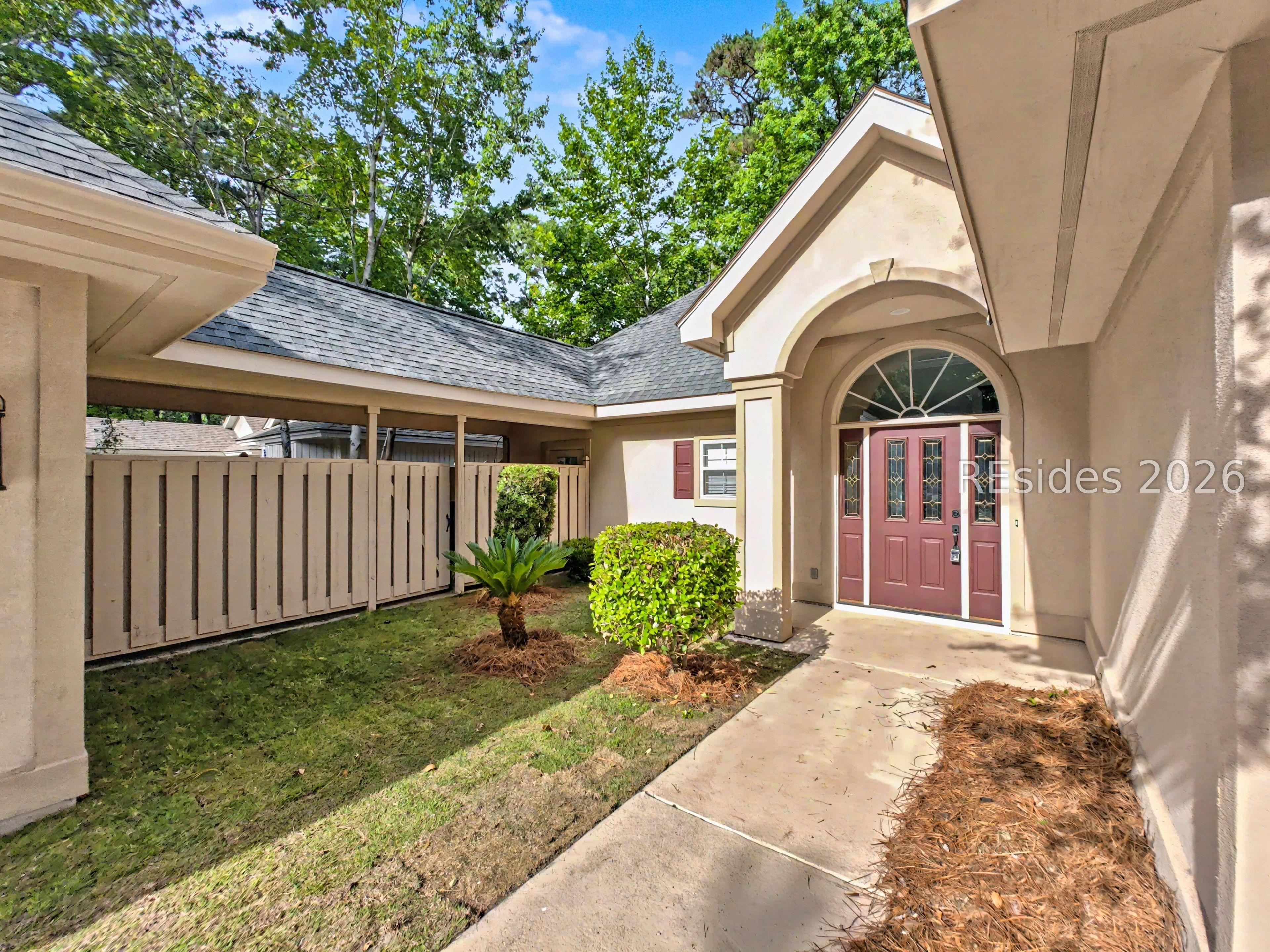 Image 3: Courtyard with breezeway connecting 2 car garage. Image 3: Courtyard with breezeway connecting 2 car garage.