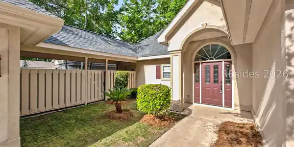 Image 3: Courtyard with breezeway connecting 2 car garage. Image 3: Courtyard with breezeway connecting 2 car garage.
