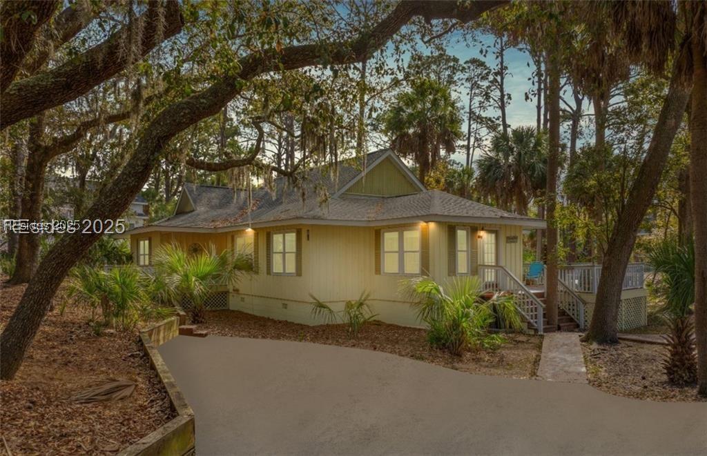 Image 4: Front view of home with large & spacious driveway