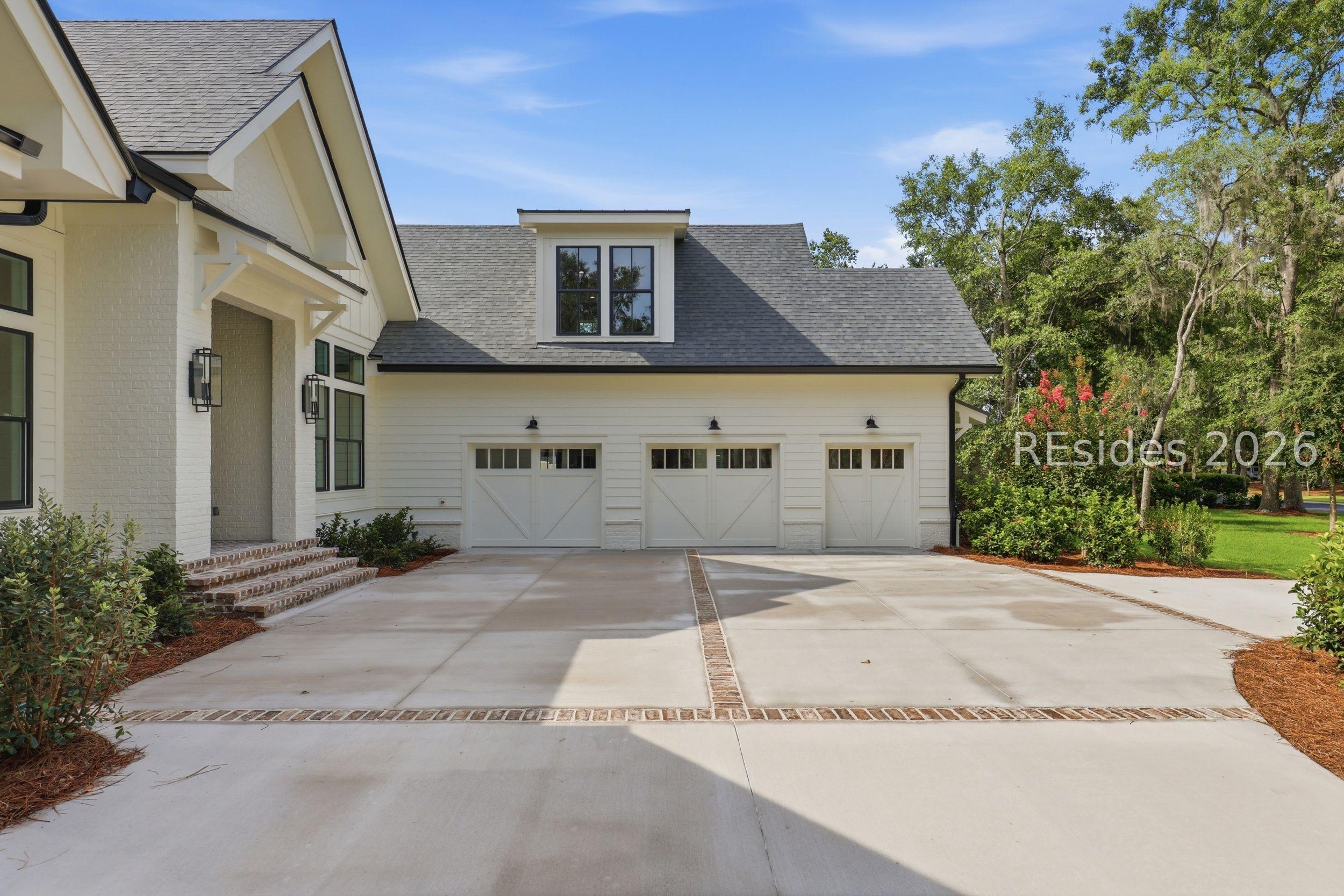 Image 3: 2 Car Garage with Additional Golf Cart Garage