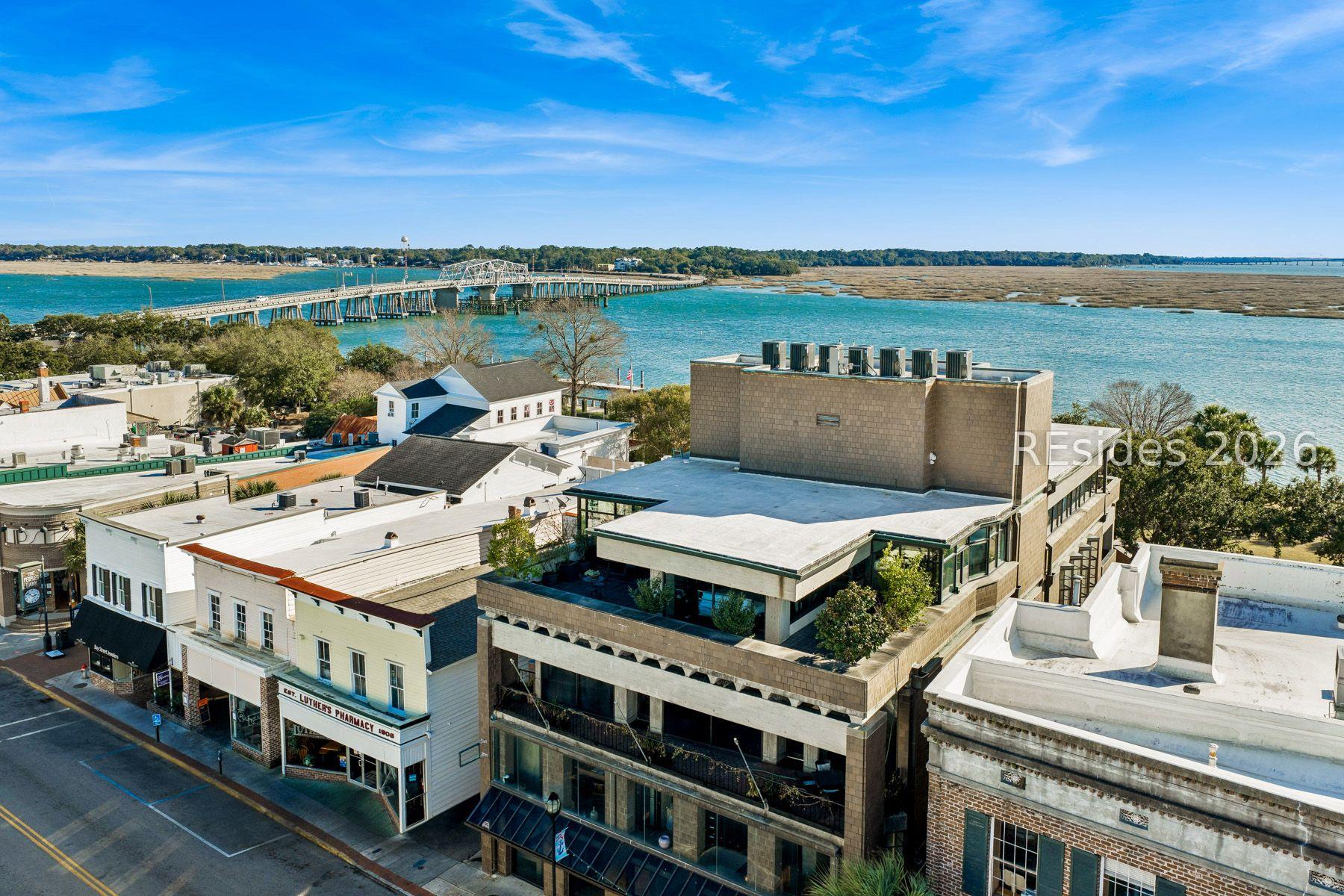 Image 2: Elevated Waterfront & Historic Downtown View