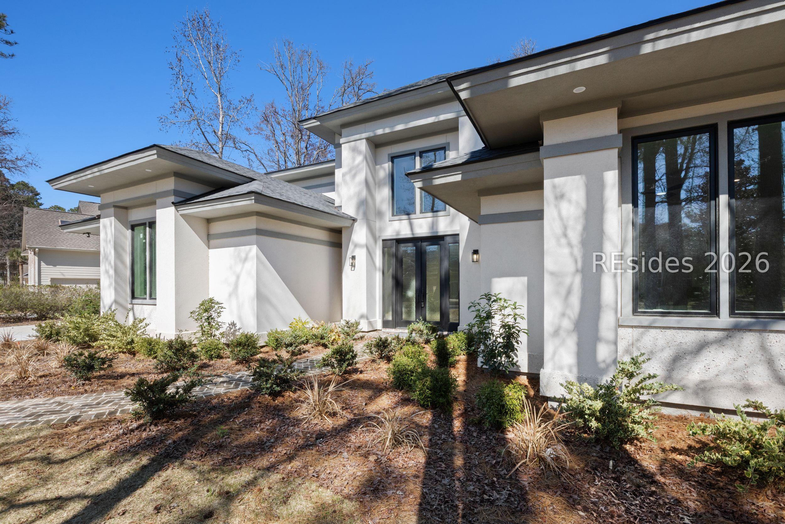 Image 4: front entry with grass enhanced
