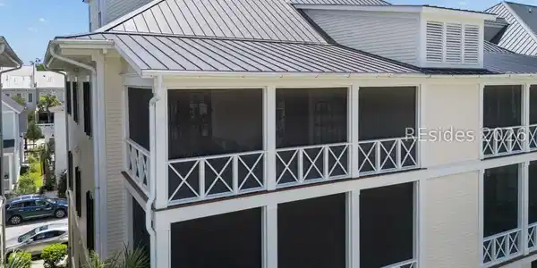 Image 2: Massive screened porch with sunset views.
