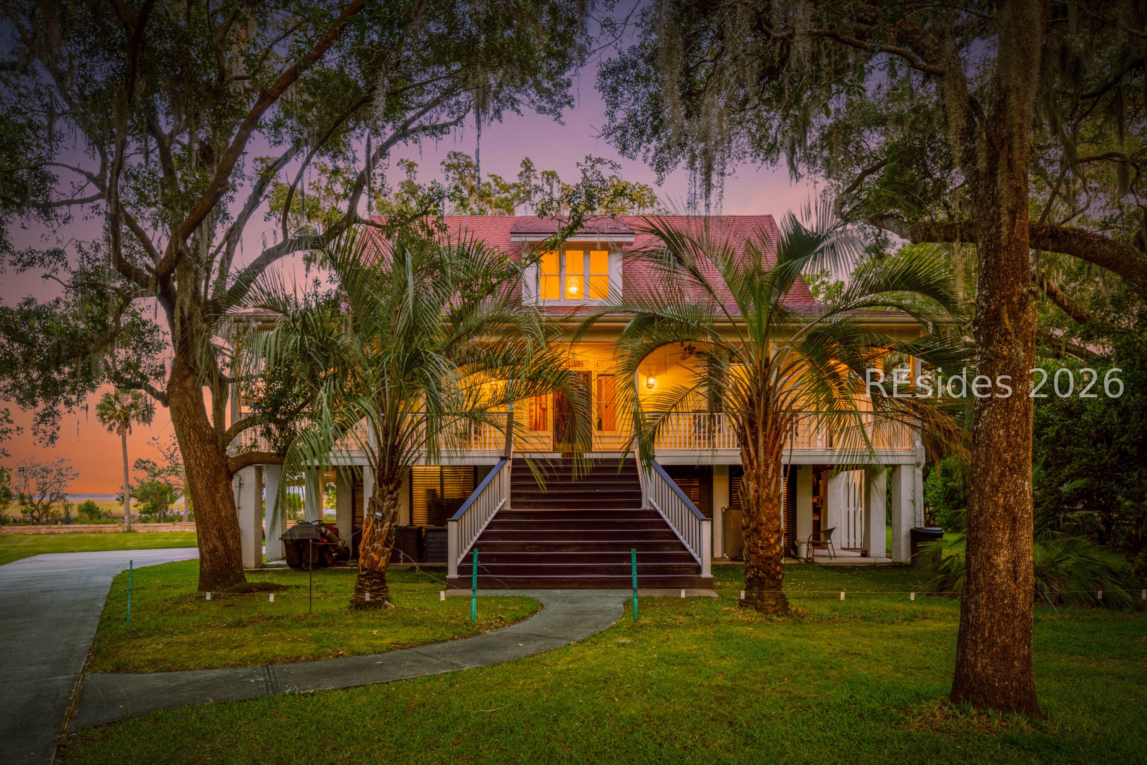 Image 1: Front of Home tucked under the Live Oaks Image 1: Front of Home tucked under the Live Oaks