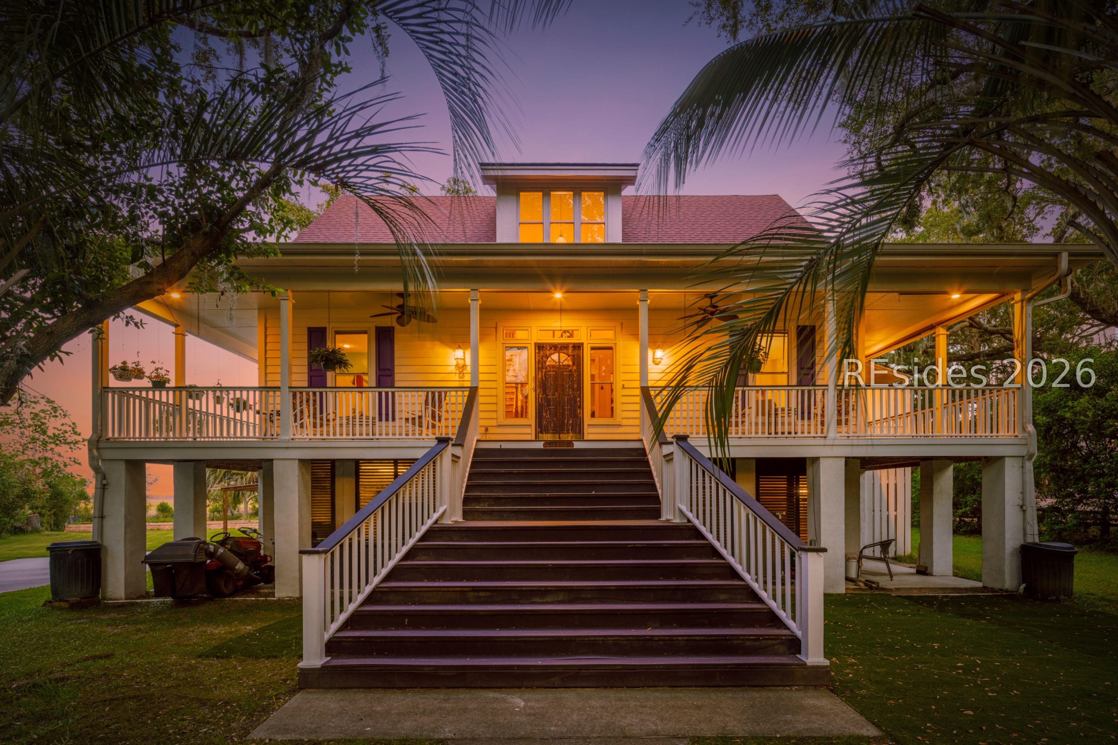 Image 2: Front of Home tucked under the Live Oaks Image 2: Front of Home tucked under the Live Oaks