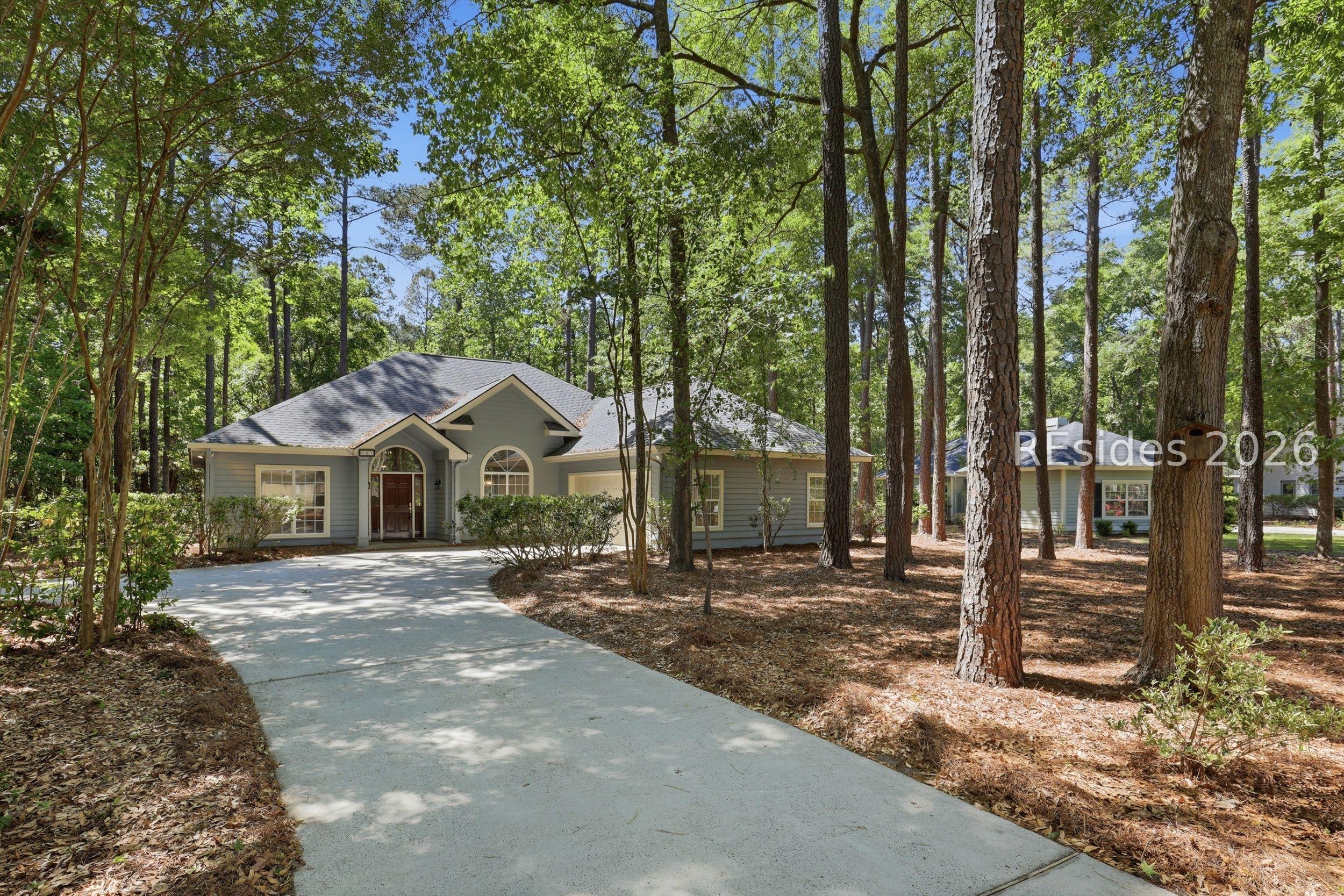 Image 2: Scenic driveway through natural landscape Image 2: Scenic driveway through natural landscape