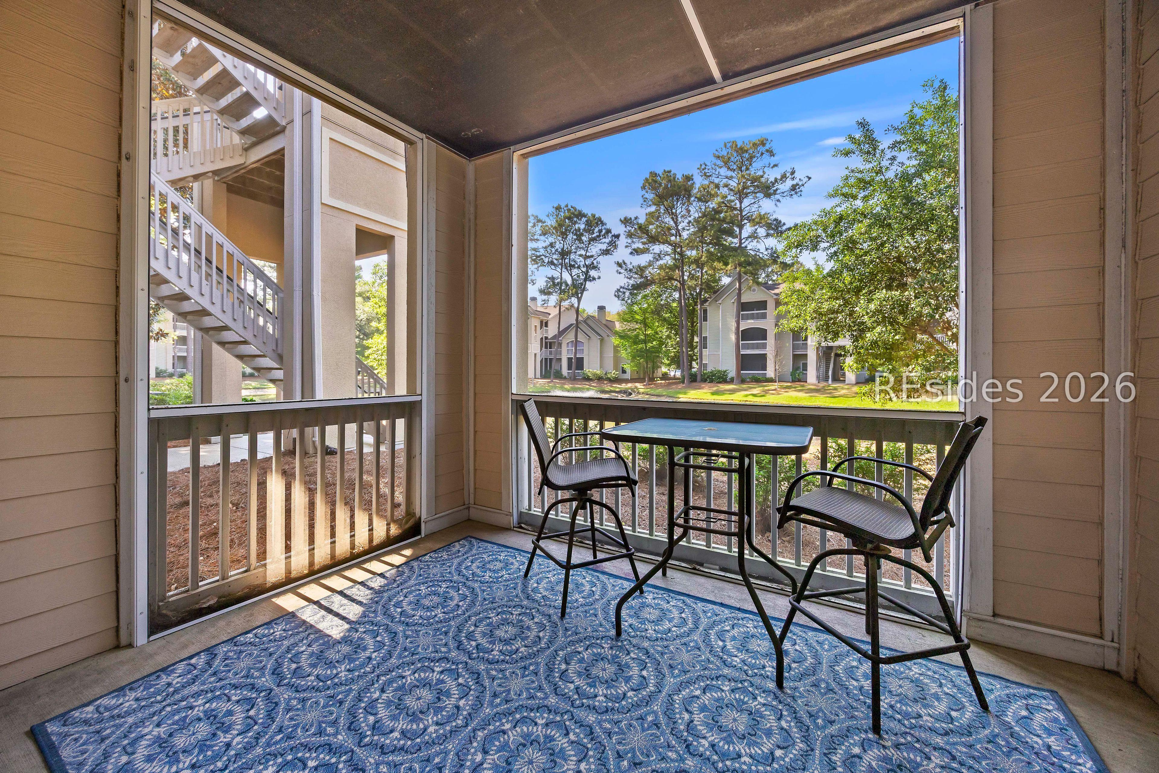 Image 4: Spacious Screened Porch with great views.