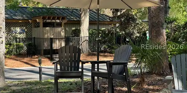 Image 3: Sit under an umbrella across from Dog Wash & pool Image 3: Sit under an umbrella across from Dog Wash & pool