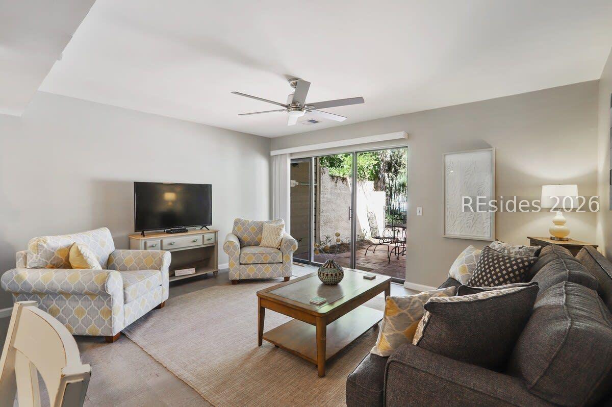 Image 2: Bright & sunny LR & walkout to courtyard & pool.