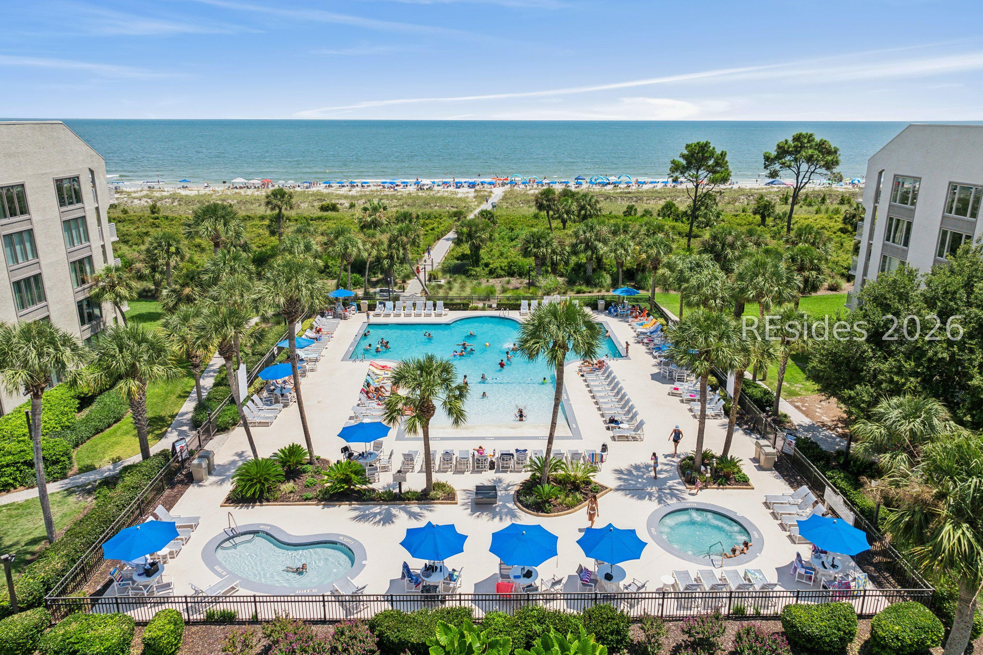 Image 2: Pool area features a hot tub and a kiddie pool