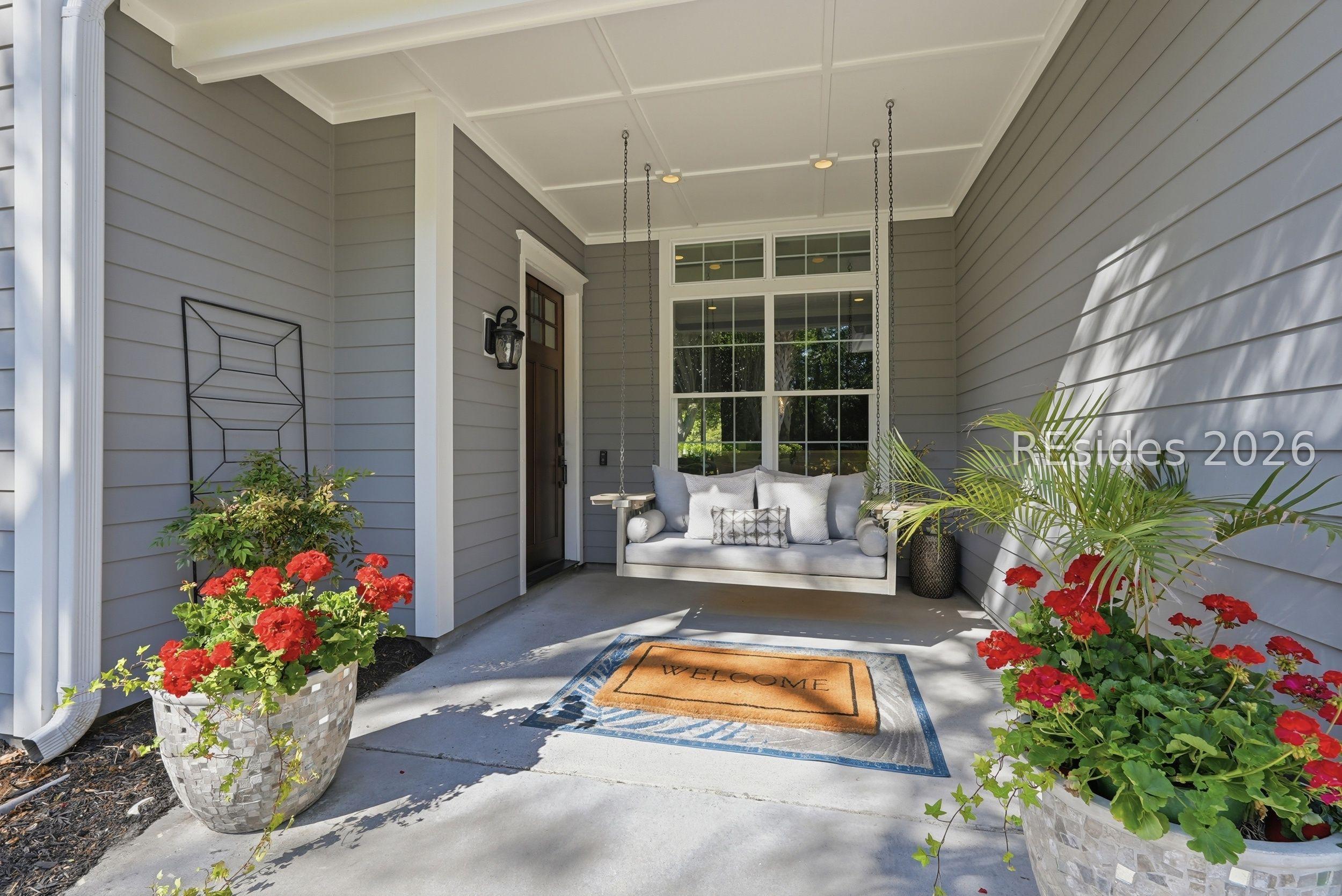 Image 3: Front porch with adorable porch swing