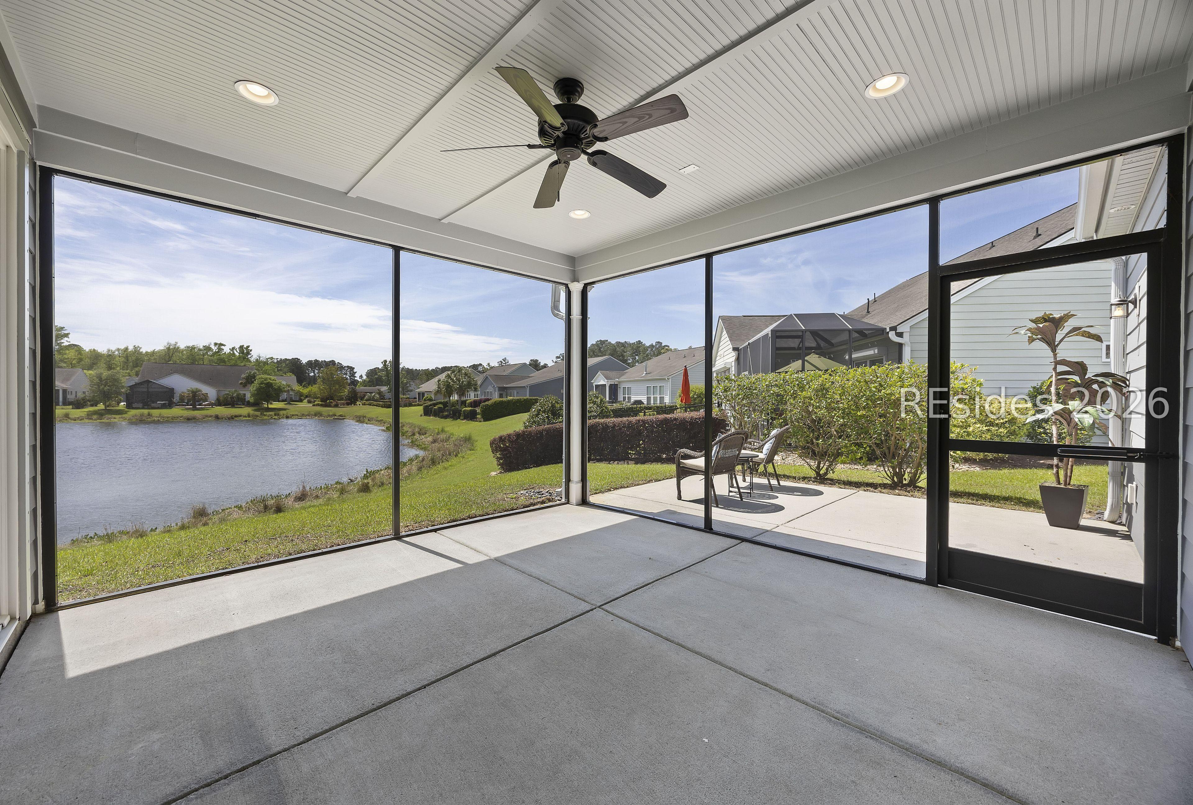 Image 2: Separate patio off screen lanai w/lagoon view Image 2: Separate patio off screen lanai w/lagoon view