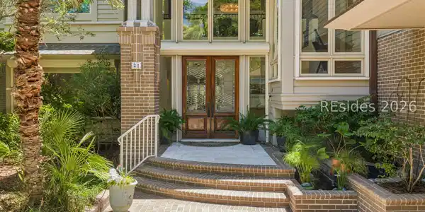 Image 3: Expansive windows and a Koi pond welcome Image 3: Expansive windows and a Koi pond welcome