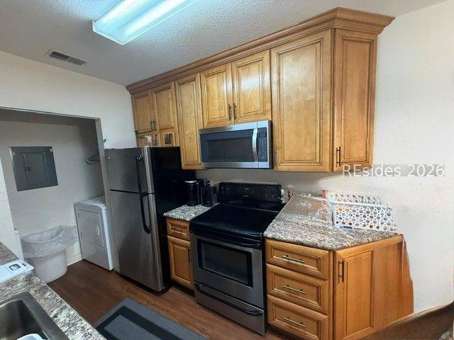 Image 2: Kitchen plus laundry room