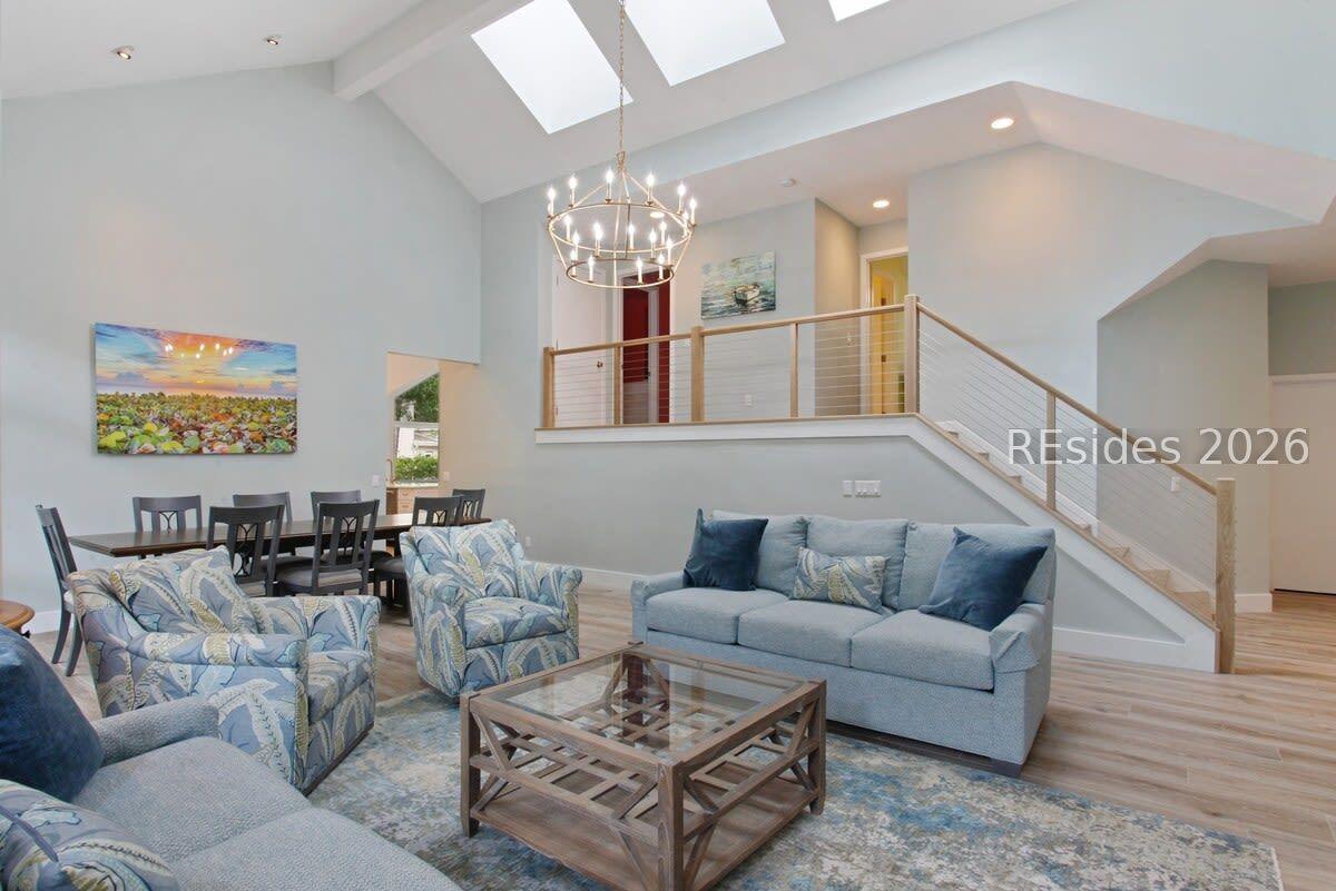Image 3: Open living & dining area  w vaulted ceilings.
