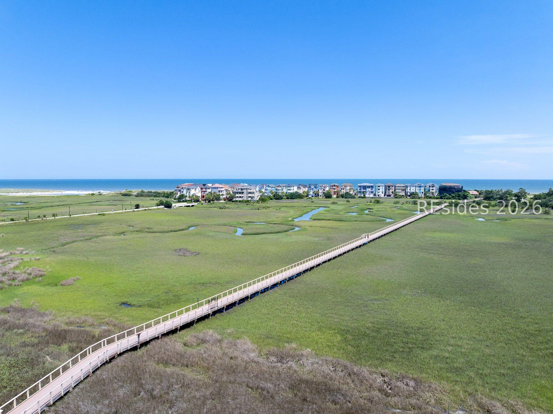 Image 1: Private beach access via scenic boardwalk