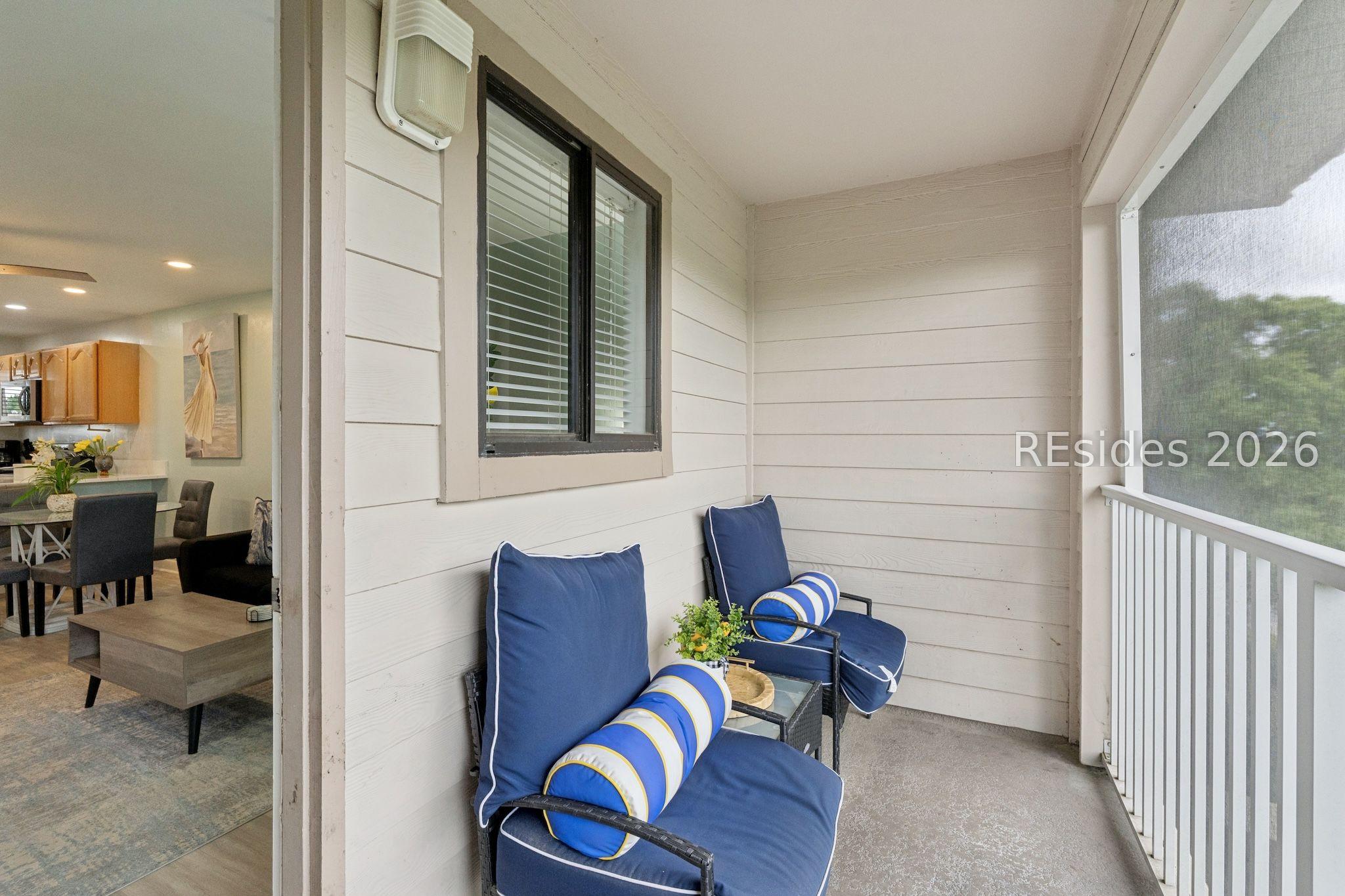 Image 3: Private screened-in rear balcony- elevated privacy