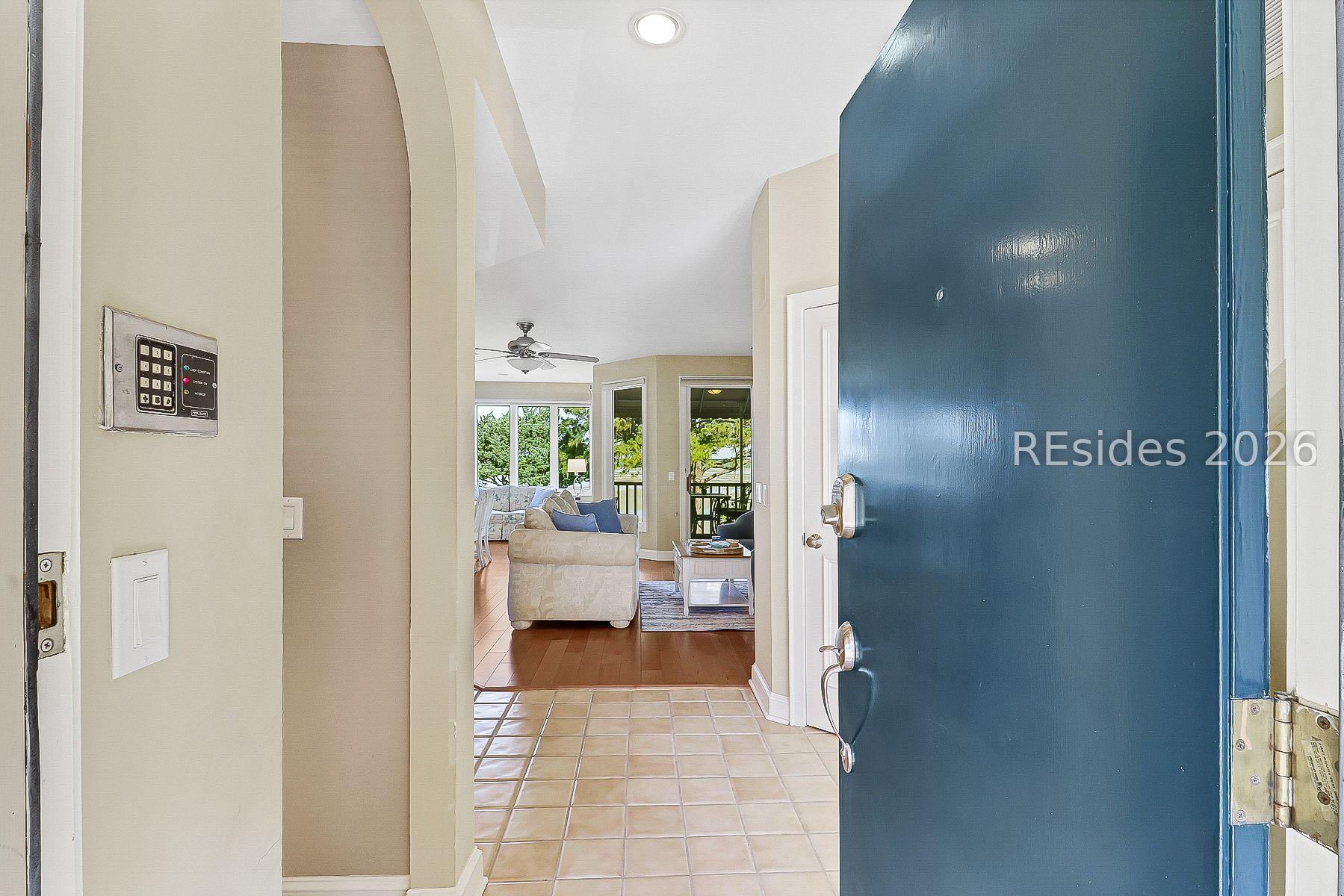 Image 4: Front door to 1206 and a peek inside.
