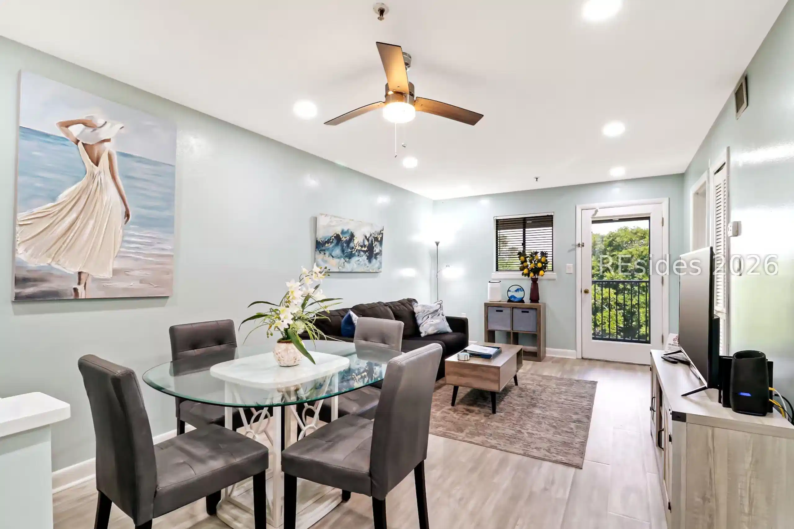Image 1: Bright living area leading to Screened Balcony Image 1: Bright living area leading to Screened Balcony