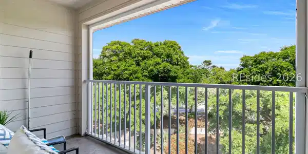 Image 2: Screened Balcony- top floor facing beautiful trees Image 2: Screened Balcony- top floor facing beautiful trees