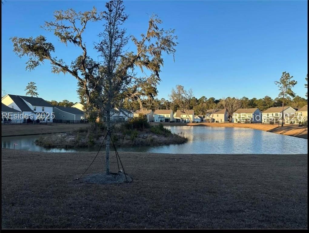 Image 2: lake view/fence back yard