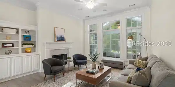 Image 3: Virtually staged formal living room off entry way