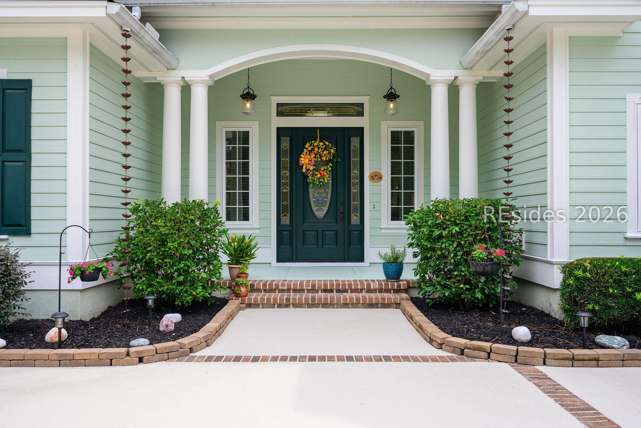 Image 4: Charming covered front porch w/brick edges.