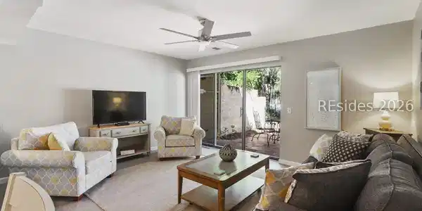 Image 3: Bright & sunny LR & walkout to courtyard & pool.