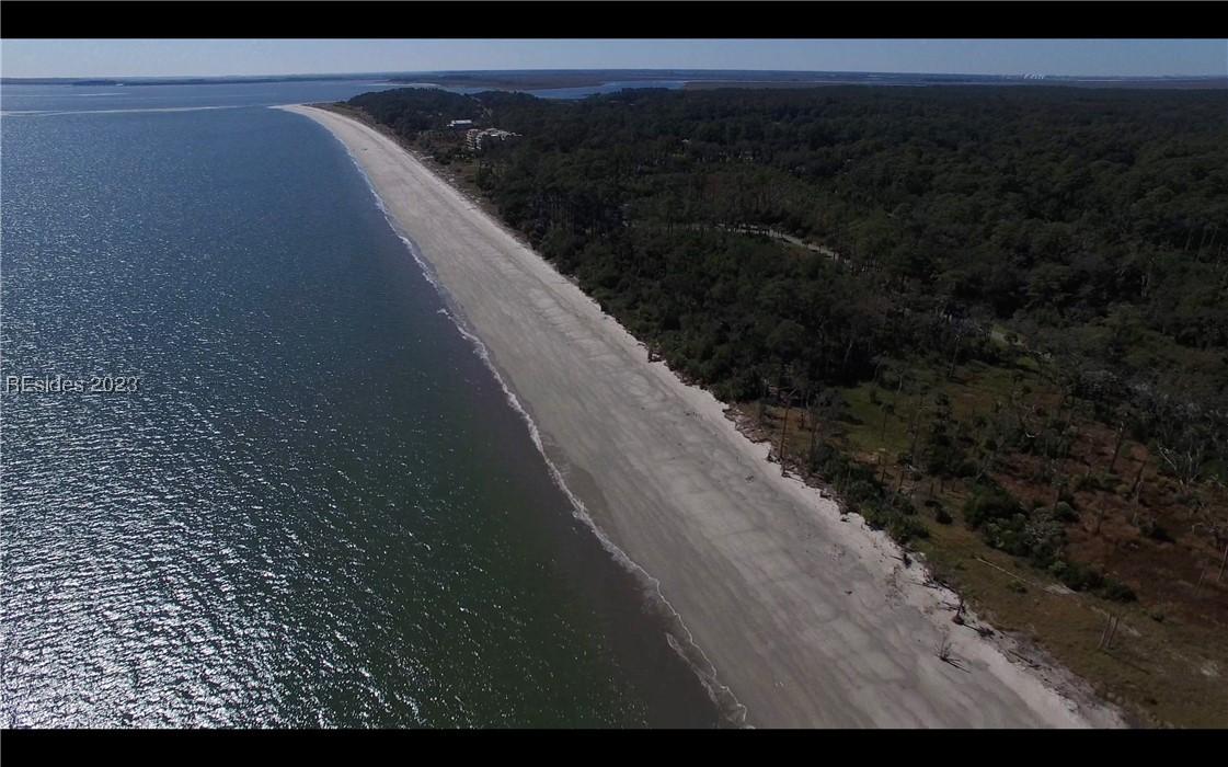 Image 2: Aerial view featuring a beach view and a water vie