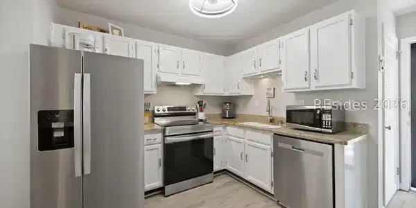 Image 3: Updated appliances in the kitchen. Image 3: Updated appliances in the kitchen.
