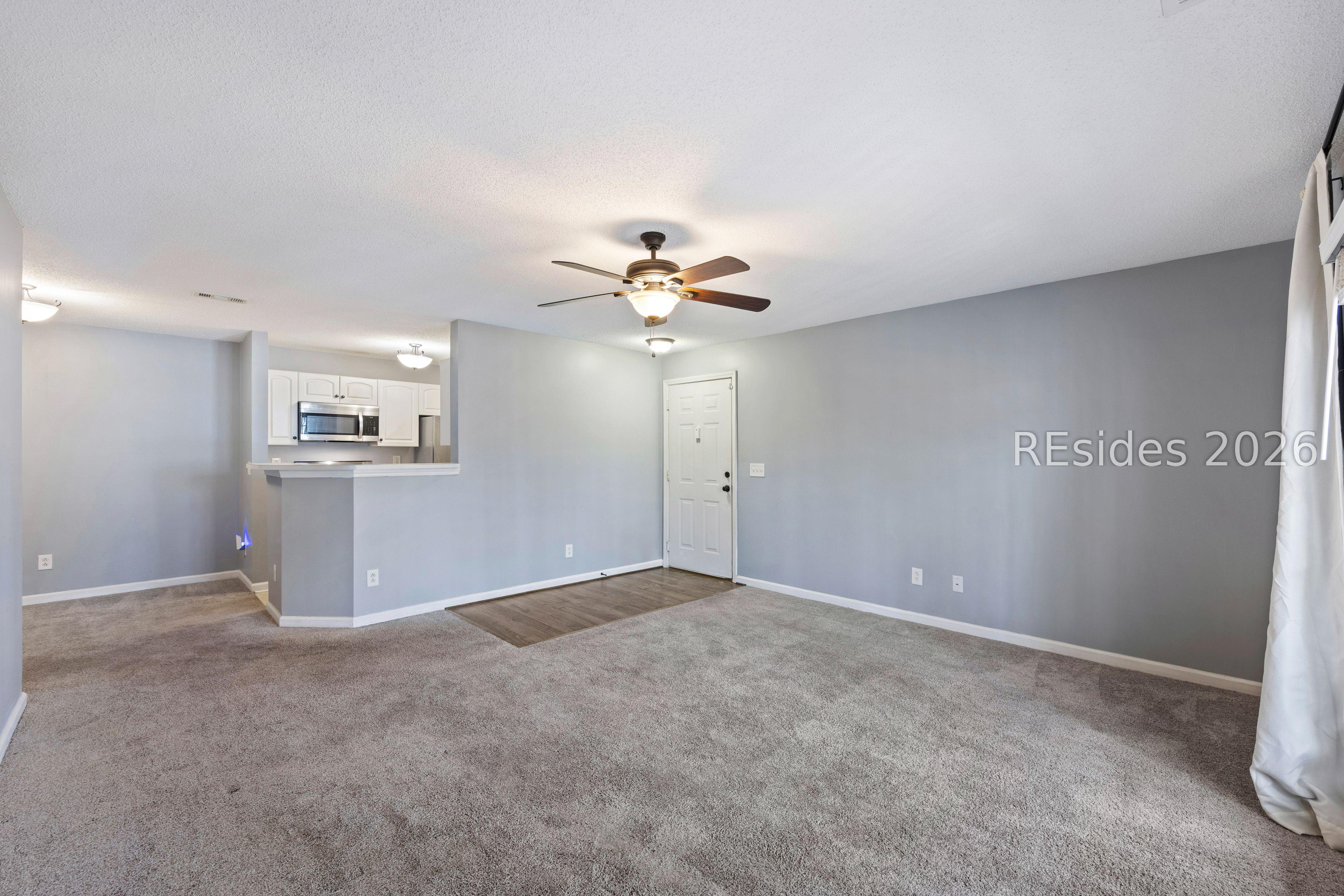 Image 1: Spacious living area overlooks woods. Image 1: Spacious living area overlooks woods.