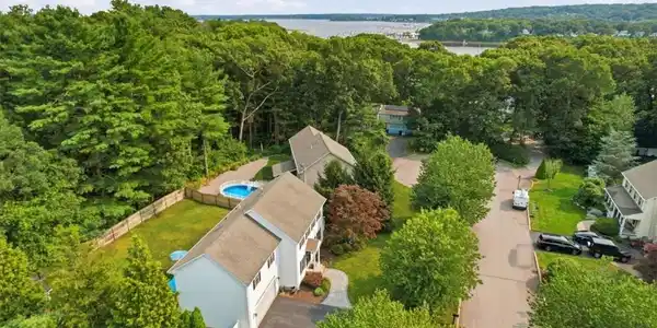 Image 4: With glimpses of the nearby bay from the neighborh