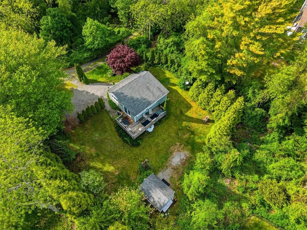 Image 3: Tree lined yard providing privacy