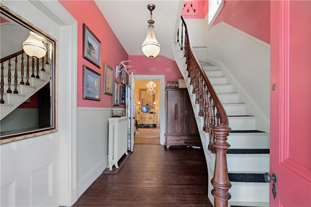 Image 3: Entry Foyer with Original Stairway