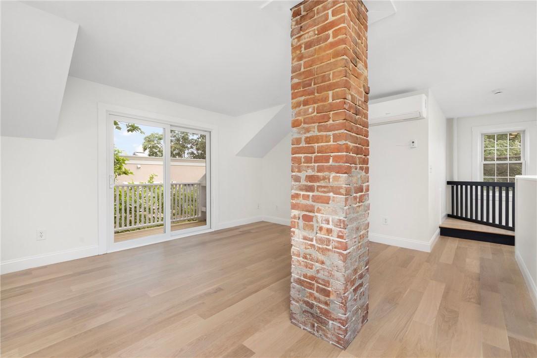 Image 3: Open concept with vaulted ceilings with private de