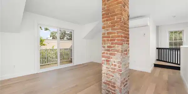 Image 3: Open concept with vaulted ceilings with private de