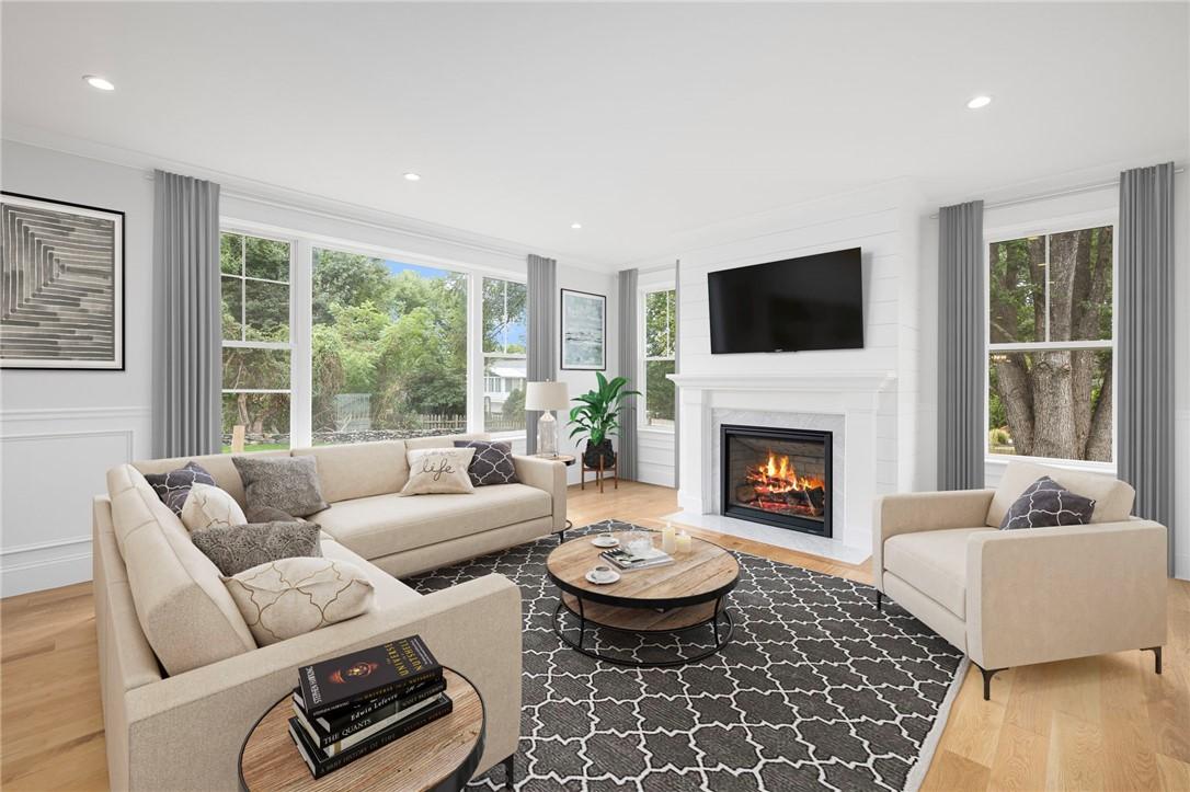 Image 3: Living Room with South Facing Light and Fireplace