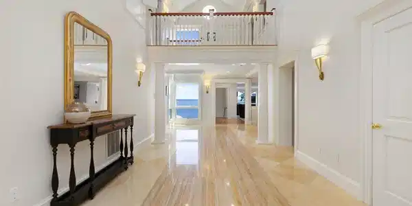 Image 3: Marble flooring with soaring ceilings presenting t