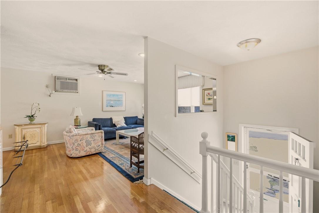 Image 3: Front entry leading to open living /dining room