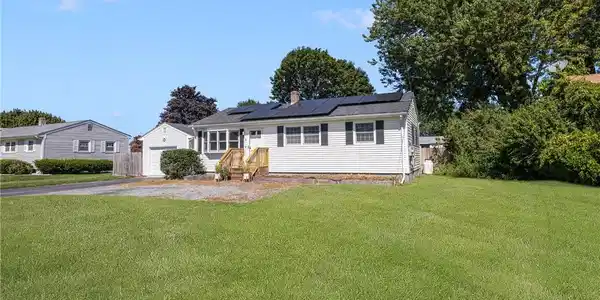 Image 2: Vinyl siding three quarters of home.