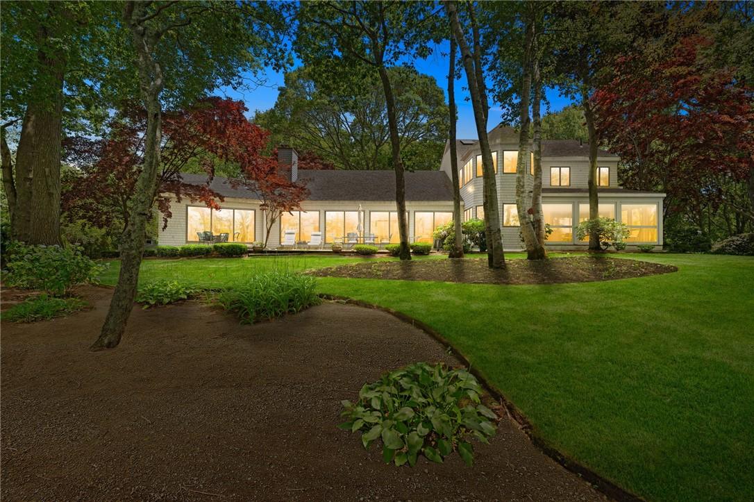 Image 2: Illuminated photo of the rear of the house looking