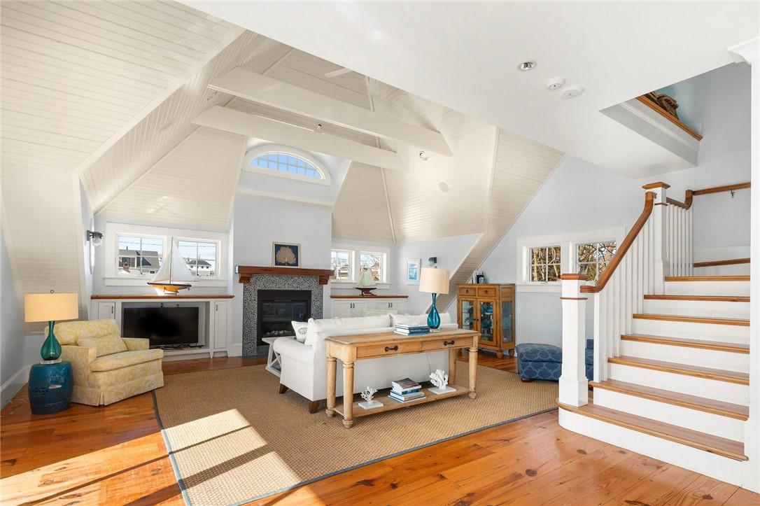 Image 3: On the second floor, a warm gas fireplace sets the