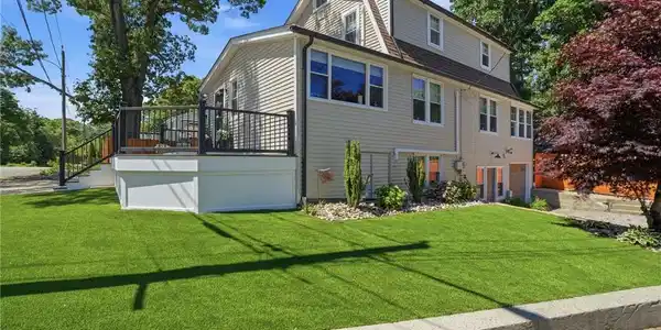 Image 3: Corner lot, front of home.