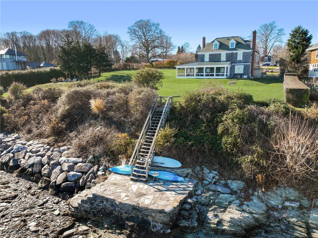 Image 4: This unique offering has a slate pad by the water'