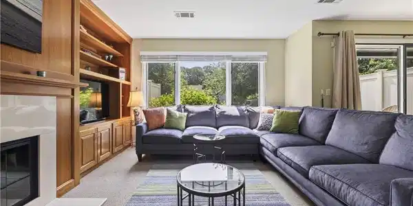Image 4: Open and spacious living room with fireplace