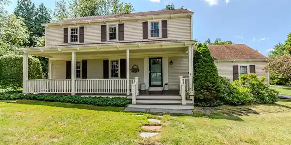 Image 2: Exterior front with porch entry