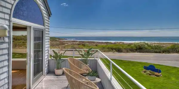 Image 2: Deck off the main level - virtually staged