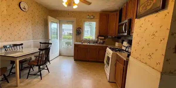 Image 2: Spacious kitchen with newer appliances.
